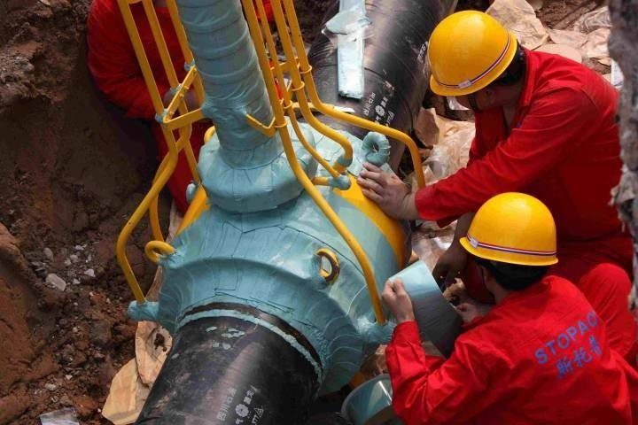 Buried valve being wrapped in a valve chamber